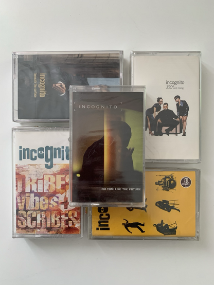 Five factory-sealed compact cassettes (tapes) containing Incognito albums — Tribes, Vibes and Scribes, Positivity, 100 Degrees and Rising, Beneath the Surface and No Time Like Future