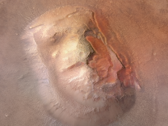 Le mesas sparse, come questa, sono comuni nella regione di Cydonia, dove gli altipiani meridionali di Marte, fortemente craterizzati, si trasformano in pianure settentrionali lisce. Molte località di media latitudine come questa hanno subito attività glaciali, che probabilmente hanno ridotto le dimensioni di questa mesa e creato le valli tozze intorno al suo livello più alto. Le macchie di materiale liscio (soprattutto sui lati orientali e settentrionali) sono probabilmente resti di ghiaccio d'acqua polveroso.
