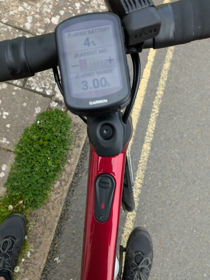 Ebike dashboard, 4% battery remaining and a red flashing light.