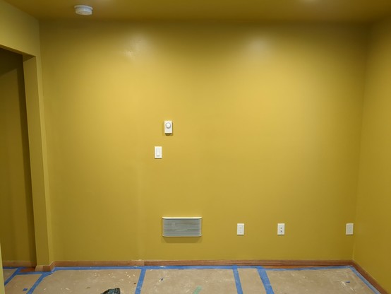 A wider shot of the formerly white wall, now a nice shade of goldenrod. I've also tied in the mahogany trim. Oh, I see that little patch I need to touch up as well.