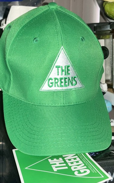 The Greens Party green cap with the triangle logo in white with The Greens lettered in green.