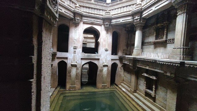 A structure with green colored water enclosed within.