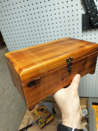A battered looking wooden box
