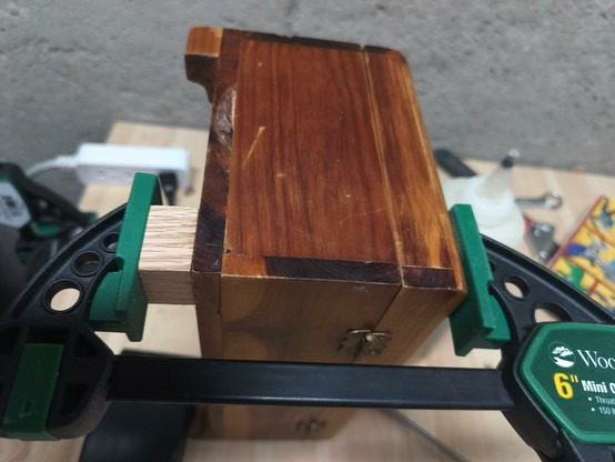 A small ash block glued to the bottom of the box and held on with a vice