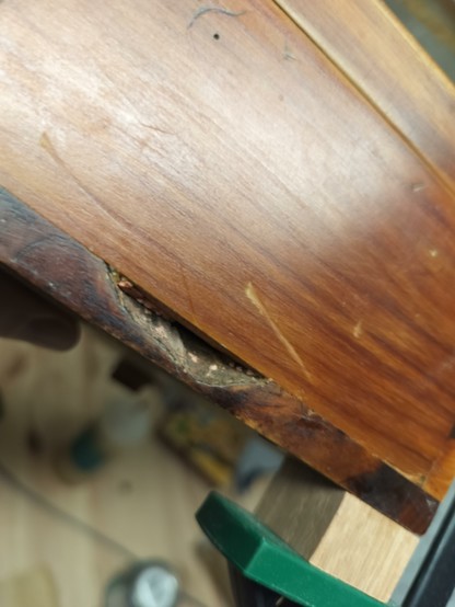 A gouge out of the box, probably where a knot was