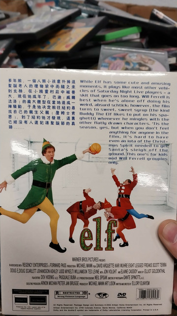 Back cover with a negative review saying how the movie is reminiscent of an SNL skit that drags on for too long