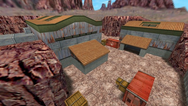 In this picture you can see the whole area again from a higher position. Only that the position is further to the left. So now the second building is also seen. Which is diagonally opposite the main building. In addition, you can see a second red container. You can also see that both buildings have windows in the roof and to the left of the main building is another extension where there is a third entrance / exit. This is on the map de_nuke in the game Counter-Strike 1.6.