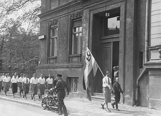 Students of the Deutsche Studentenschaft, organized by the Nazi party, parade in front of the Institute for Sexual Research on Beethovenstraße, Berlin, on 6 May 1933