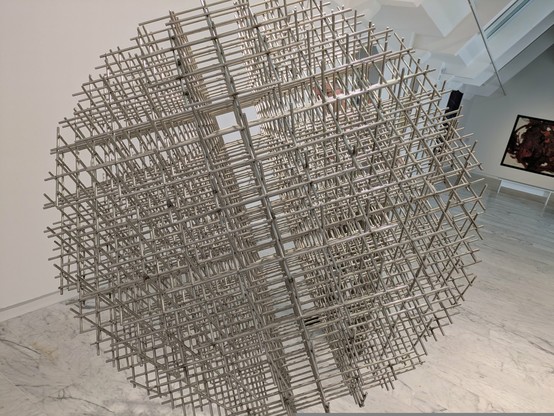 A sculpture made from many metal rods welded together at right angles. Overall, it creates a spherical volume which looks different from different viewpoints due to moire effects. Sadly I don't seem to have noted the artist. This was at the [mac] in Marseille.