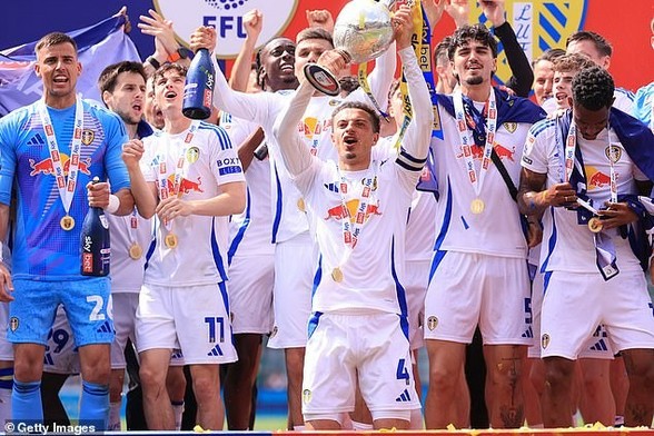 Leeds hoisted the Championship trophy aloft after booking their return to the Premier League