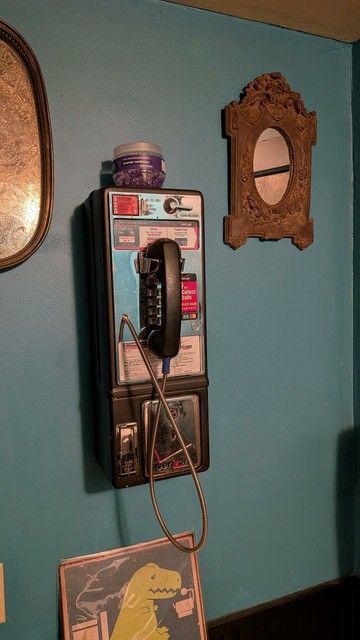 A remarkably pristine Verizon payphone.  There is a small piece of duct tape over the coin slot.