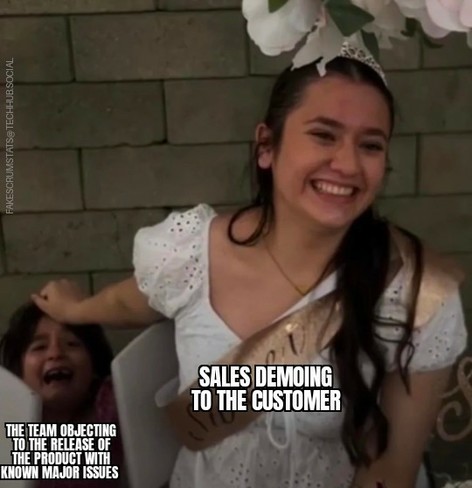 Photo of a teen girl labeled Sales demoing to the customer, holding back the head of an upset boy behind her who is labeled The team objecting to the release of the product with known major issues