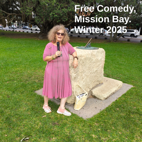 Tessa Clement leans against the sundial in Selwyn Domain, Mission Bay. She has a microphone in her hand. Text: Free Comedy, Mission Bay, Winter 2025.