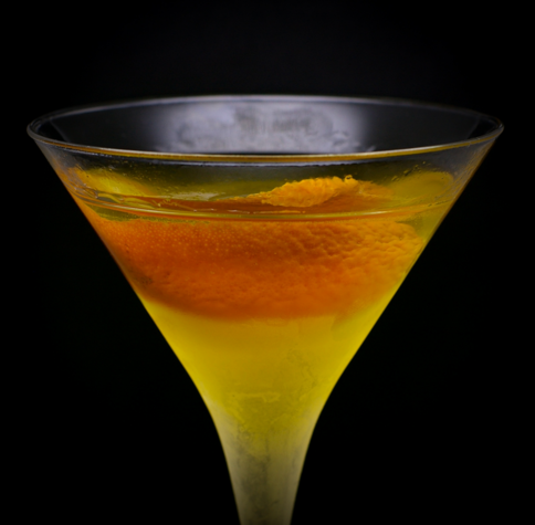 The cocktail itself in a chilled Martini glass and garnish with an orange twist