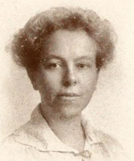 Amy Louise Reed from the 1917 yearbook of Vassar College; a middle-aged white woan with light curly hair in an updo, wearing a white blouse