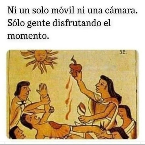 Illustration from ancient codex. A high priest extract a beating heart from a prisonier and offersbit to the sun.