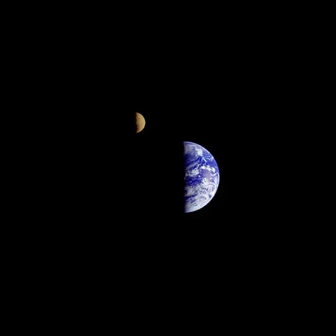 The Earth and Moon, hanging in space side by side