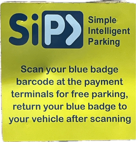 Parking sign. Claims to be simple intelligent parking. Instructions telling disabled people to enter the building, scan their badge, return to their car with their badge, then re-enter the building for their appointment.