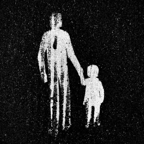 A faded white silhouette of an old pedestrian sign painted on pavement, picturing a man holding a child's hand, set against a dark background with light spots.