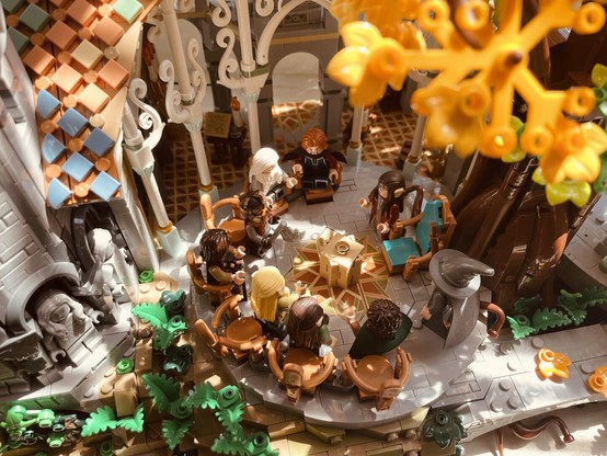 A photo of the Lego set ”Rivendell“ from The Lord of the Rings showing Elrond‘s council in warm sunlight.