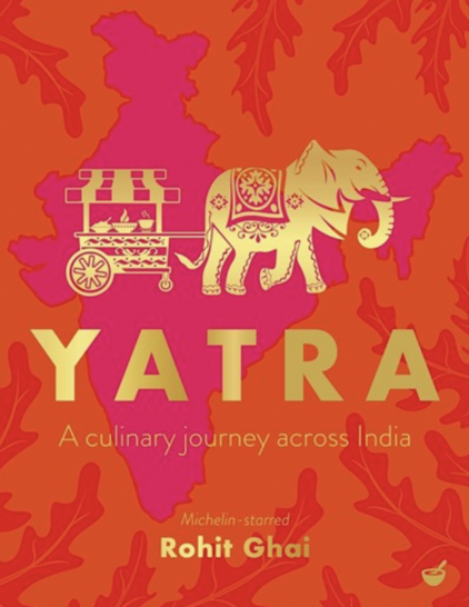 Yatra. Red and orange cover. A drawing of an elephant and food cart. Yellow text.