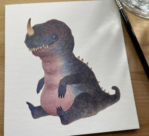 a dinosaur-like monster sits on his bottom as if begging like a dog, his pink tummy showing. He has a large grin and blue eyes and a little horn that sticks out of his nose.
