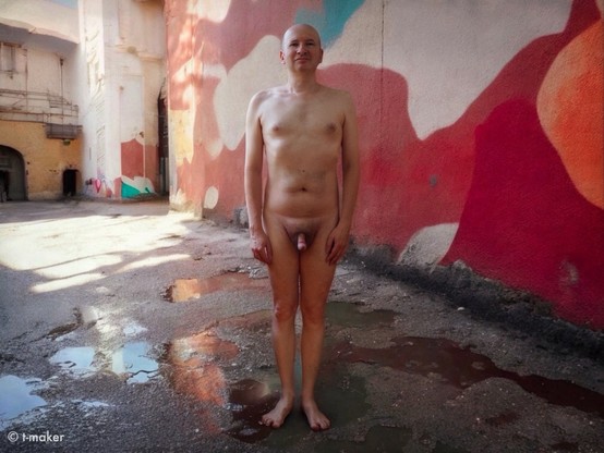 Me naked in the half-abandoned urban area in summer. Self-Portrait. Front view