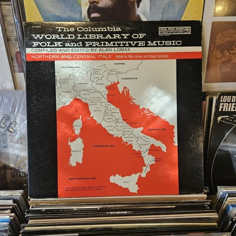 Album cover features a map of Italy. Back album cover features a black and white photograph of an elderly Italian couple.