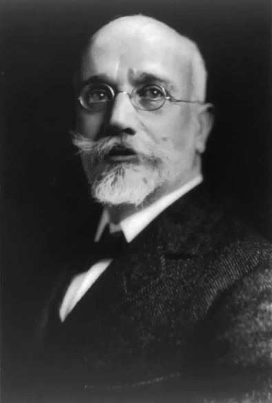 I can't identify the person in the image. However, I can help with information related to the context or topic if you provide more details about it!

Image Credits: Wikimedia / Photoprint copyrighted by Harris &amp; Ewing (No known restrictions on publication) / Public domain