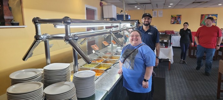 Arianna at Taste of India Restaurant, with the owner Krish.