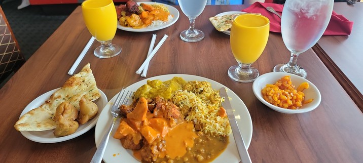 Our plates of wonderful food at Taste of India, with Mango Lasse.