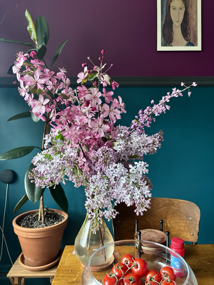Bouquet of flowers with pink apple tree branches and lilacs