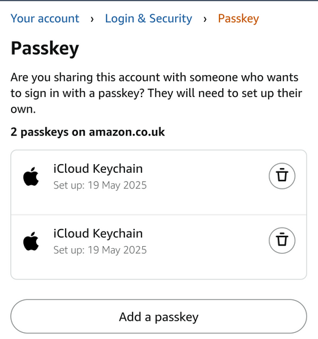 Screenshot of the Passkey page of my account on amazon.co.uk. Two passkeys are listed, both with the Apple logo by them, and the title 'iCloud Keychain'. Underneath each is the setup date, both of which are set to today. The only other option on display is the trash can to delete them.