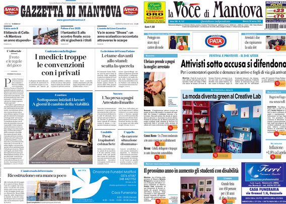 Schermo di un tablet acceso che mostra le prime pagine di due quotidiani locali di Mantova, “Gazzetta di Mantova” e “La Voce di Mantova”. Le pagine sono visualizzate affiancate e in formato ridotto, quindi i testi sono difficili da leggere nei dettagli. Si distinguono i titoli principali: sulla “Gazzetta di Mantova” si legge “I medici: troppe le convenzioni con i privati”, mentre su “La Voce di Mantova” il titolo principale è “Attivisti sotto accusa si difendono”. Sono presenti anche alcune immagini e riquadri colorati tipici delle prime pagine dei giornali.