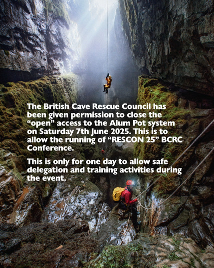 This image shows a dramatic caving scene inside a deep, narrow rocky shaft covered partly with moss. Sunlight streams down from an opening high above, illuminating mist and dust particles in the air, creating a mystical atmosphere. A caver in bright yellow gear is descending the shaft by a rope near the centre of the image, silhouetted against the light. Below, another caver wearing a red jacket, a red helmet with a headlamp, and a yellow backpack is preparing to descend or ascend with ropes, positioned on a rocky ledge covered in moss. The cave walls are steep and rugged, emphasizing the depth and scale of the underground environment. Overlaid on the image is bold white text announcing the British Cave Rescue Council’s permission to close the open access to the Alum Pot system on 7th June 2025 for a single day, allowing safe delegation and training activities during the RESCON 25 conference. The overall mood is adventurous and serious, highlighting both the natural beauty and the operational aspect of cave rescue training.