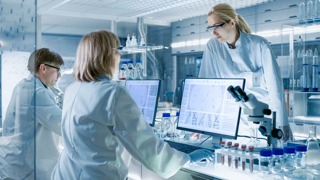 Scientists in clinical research lab. Image credit: Gorodenkoff via Adobe Stock.