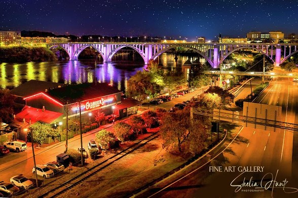 Knoxville Tennessee night aerial view of Henley Bridge and Calhouns on the River over the Tennessee River skyline. From the Fine Art Gallery of Shelia Hunt.