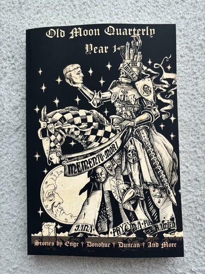 The cover of the Old Moon Quarterly Year 1 collection, showing a monochrome illustration of a mounted knight examining a severed head.