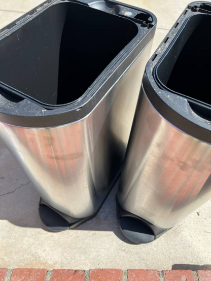 Two trash cans without lids, stainless steel sides