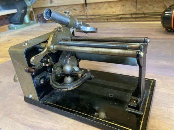 closeup of an antique cylinder player. the horn is missing in this photo.