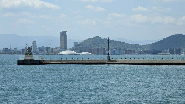 The Kagawa Arena seen from Megijima's port. There's also Takamatsu skyline as well as the Oni Lighthouse from Megijima.