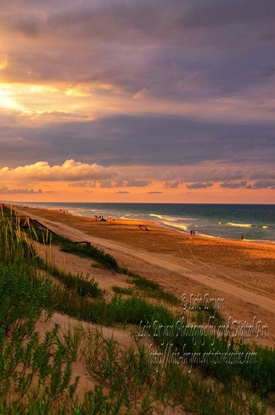 Golden sunlight bathes a serene beach, with gentle waves lapping at the shore under a dramatic sky. People stroll along the sand, enjoying the tranquil evening atmosphere.

Some of my favorite ways to daydream about the beach are remembering early morning wave-watching with a cup of coffee in my hands and my bare toes in the still-cool sand. Another is sitting under an umbrella on a sunny day with a good book in my lap. But one of the best is an evening stroll, watching the way the light lights up the sky.

"An Evening Stroll" ... my newest post ... a lovely evening stroll along the beach at the #OuterBanks in #Corolla, #NorthCarolina ... captured in July of 2020 with the Nikon D7000.  

available at my website:  https://lois-bryan.pixels.com/featured/an-evening-stroll-lois-bryan.html

and at #FineArtAmerica:  https://fineartamerica.com/featured/an-evening-stroll-lois-bryan.html

#art #sunset #AtlanticOcean #beach #NotAi #LoisBryan