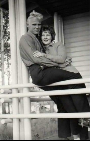 An old black and white photo where my parents are young. My father is holding my mother. My father has a blond hair and my mother dark. The photo is like from an old Finnish movie.