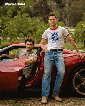 Photoshoot:
David Corenswet wearing a grey t-shirt and sitting in a red sports car. He's in the middle of leaving the car, the car door is already open. Next to the open car door is Nicholas Hoult leaning casually against the sports car in jeans, a white shirt with blue print and beige boots. Both look hot!