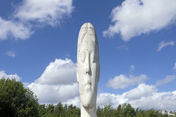 The Dream Sculpture, a large elongated white head in the woods.