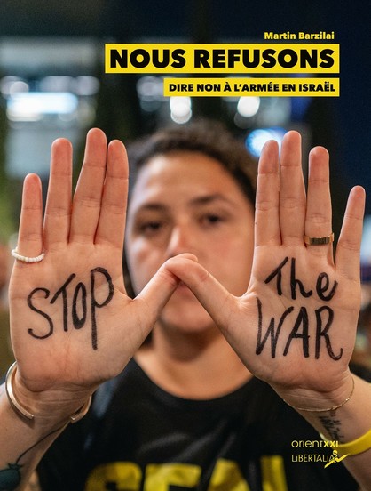 A person holds up both hands with the phrases "STOP" on the left hand and "The WAR" on the right hand. The background is blurry, suggesting an indoor setting. The image includes text overlaying it that reads "NOUS REFUS