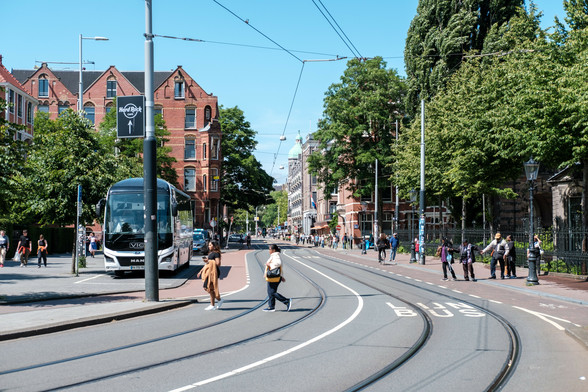 Pedestrians crossing the street in the Museumkwartier district of Amsterdam.