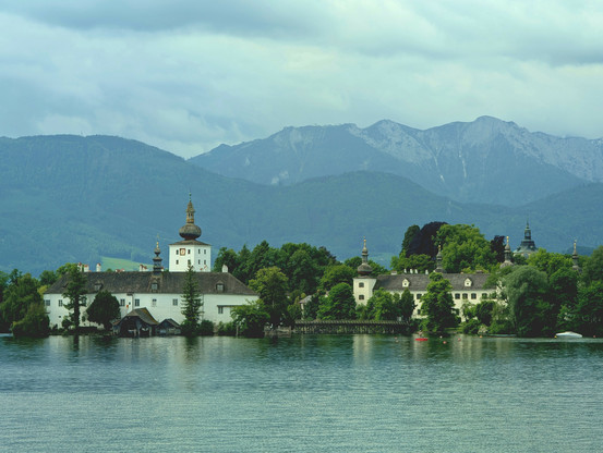 Castle on lake Traun, and another castle on the shoreline of lake Traun, at Gmunden, Oberösterreich, Austria. May2025.