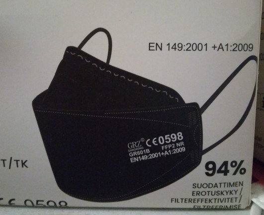 Picture of black FFP2 mask on a box of them.
CE0598, GR6091B, FFP2 NR, EN149:2001+A1:2009 94% filtration.