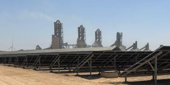 Lucky Cement’s solar panels and wind turbines are close to its cement production facilities © Humza Jilani/FT
